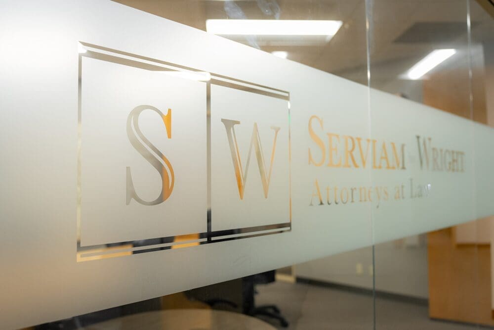 Serviam by Wright LLP door emblem